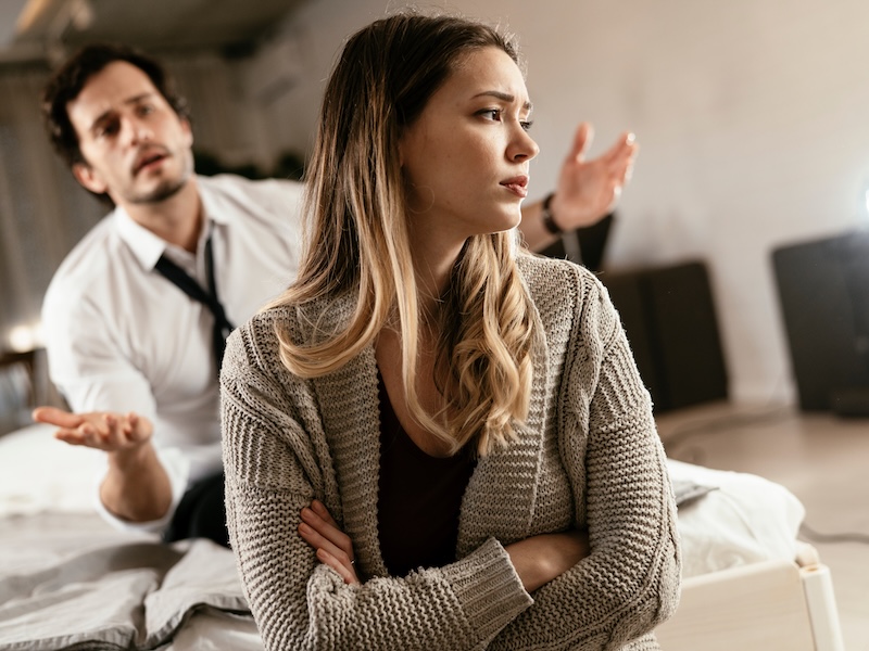 Boyfriend and girlfriend are arguing at home Angry man is yelling at his sad girlfriend Boyfriend and girlfriend are arguing at home. Angry man is yelling at his sad girlfriend.